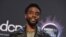 FILE - Chadwick Boseman poses in the press room at the American Music Awards on Nov. 24, 2019, at the Microsoft Theater in Los Angeles. 