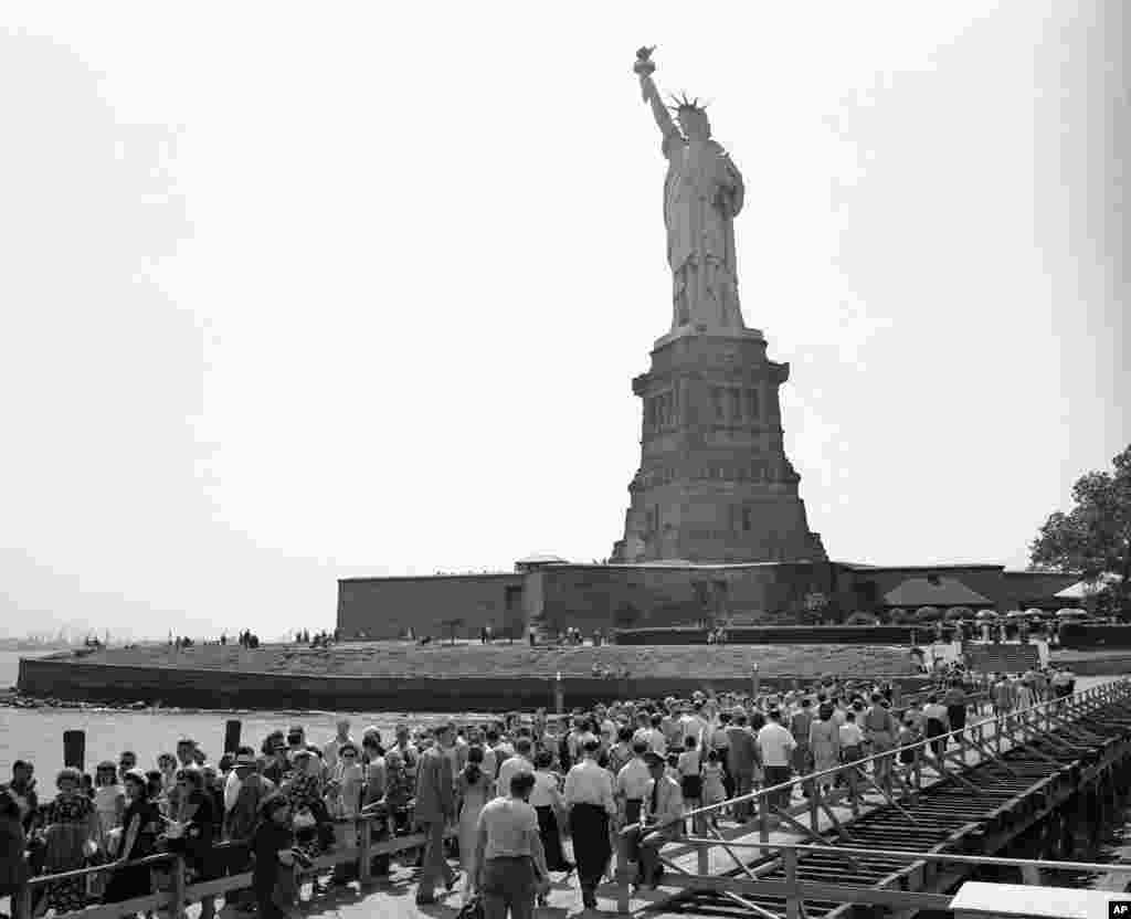 Visitors move toward the base of the Statue of Liberty on Bedloe’s Island in New York’s harbor on July 12, 1948. 