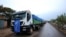 FILE - The World Food Program (WFP) convoy trucks carrying food items for the victims of Tigray war are seen parked after the checkpoints leading to Tigray Region were closed, in Mai Tsebri town, Ethiopia, June 26, 2021.