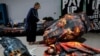 Activists lie next to fake currency bills as they participate in a protest during the United Nations climate change conference COP29 in Baku, Azerbaijan, Nov. 20, 2024. 