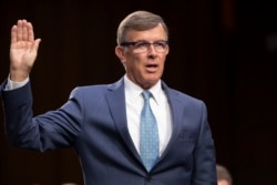 FILE - Retired Vice Adm. Joseph Maguire appears at a hearing on Capitol Hill in Washington, July 25, 2018. Maguire serves as acting national intelligence director.