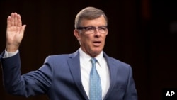 FILE - Retired Vice Adm. Joseph Maguire appears at a hearing on Capitol Hill in Washington, July 25, 2018. President Donald Trump has named Maguire acting national intelligence director.