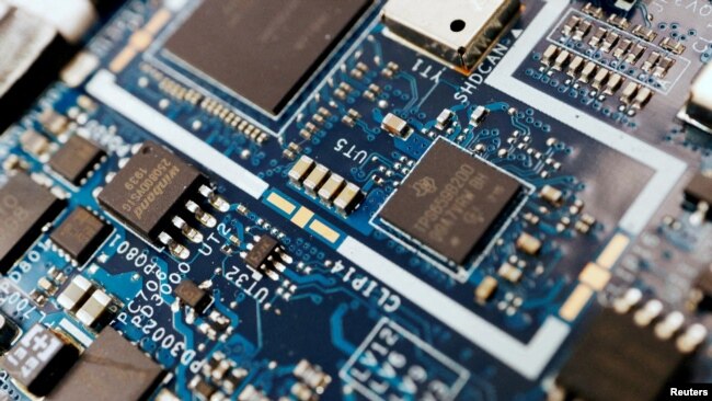 FILE PHOTO: Illustration picture of semiconductor chips on a circuit board