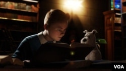 Tintin dan anjingnya, Snowy, dalam salah satu adegan dalam film 'The Adventures of Tintin.'