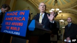 Senate Majority Leader Mitch McConnell of Ky. speaks during a news conference on Capitol Hill in Washington, May 19, 2015, with small business owners to discuss the Trade Promotion Authority bill. 