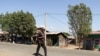 FILE - A member of the Amhara Special Force patrols a street in Soroka village in Amhara region near a border with Tigray, Ethiopia, Nov. 9, 2020. 