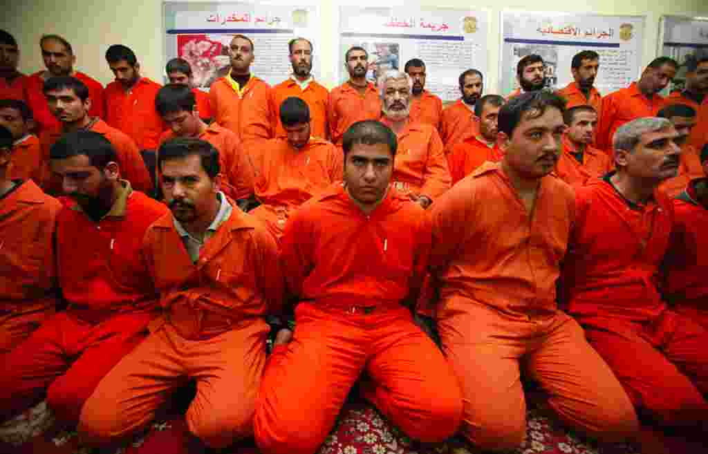 Detainees are displayed for the media during a news conference by Iraq's Interior Minister in Baghdad December 2. Security forces arrested 39 al Qaeda militants, including the group's leadership in Anbar province and one of its top officers in Iraq, in ra