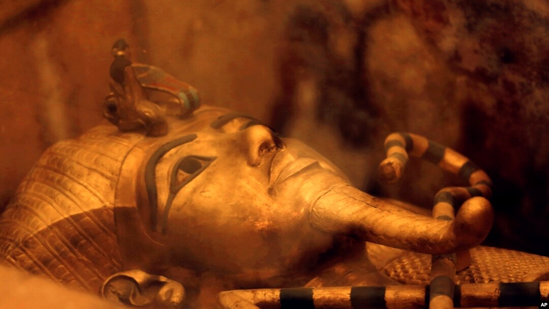 FILE - One of Egypt's famed King Tutankhamun's golden sarcophagus is displayed at his tomb in a glass case at the Valley of the Kings in Luxor, Egypt, April 1, 2016.