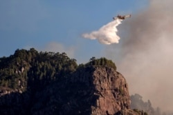 A hydroplane operates on a wildfire in Canary Islands, Spain, Aug. 20, 2019.