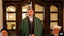 Afghan President Hamid Karzai, center, speaks during the inaugural session of Afghanistan's new peace council in Kabul, Afghanistan, 7 Oct. 2010