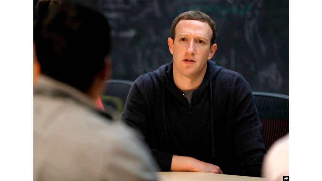 FILE - Facebook CEO Mark Zuckerberg meets with entrepreneurs and innovators during a round-table discussion in St. Louis, Nov. 9, 2017.