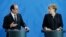German Chancellor Angela Merkel, right, and the President of France, Francois Hollande, left, address the media during a joint statement as part of a meeting at the chancellery in Berlin, Germany, Jan. 27, 2017.