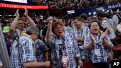 Guam delegates react during the opening day of the Republican National Convention in Cleveland, Ohio, July 18, 2016. U.S. citizens in Guam enjoy participation in the U.S. political process but are denied the right to vote for president.