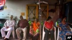 COVID-19 patients receive oxygen outside a Gurdwara, a Sikh house of worship, in New Delhi, India, May 1, 2021.