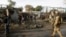 NATO and Afghan troops arrive at the site of a suicide attack in Jalalabad, Afghanistan, March 26, 2013. 