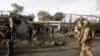 NATO and Afghan troops arrive at the site of a suicide attack in Jalalabad, Afghanistan, March 26, 2013. 