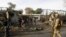 NATO and Afghan troops arrive at the site of a suicide attack in Jalalabad, Afghanistan, March 26, 2013. 