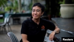FILE - Filipino journalist and Rappler CEO Maria Ressa, one of the 2021 Nobel Peace Prize winners, speaks during an interview in Taguig City, Metro Manila, Philippines, Oct. 9, 2021.