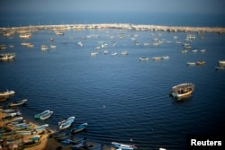 Fishing boats float at the Seaport of Gaza City, April 4, 2016. On April 3, 2016, Israel extended the distance it permits Gaza fishermen to head out to sea along certain parts of the coastline of the enclave, which is run by the Islamist group Hamas.