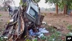 In this grab made from video provided by KK Productions, the wreckage of a car which came under an IED (improvised explosive device) blast is seen in the Dantewada district of Chhattisgarh, India, April 9, 2019. 