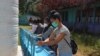 FILE - Students wash their hands in an undated picture. 