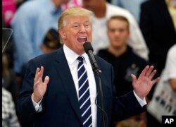 Republican presidential candidate Donald Trump speaks at a campaign rally at Open Door Christian Academy, Friday, Oct. 28, 2016, in Lisbon, Maine.