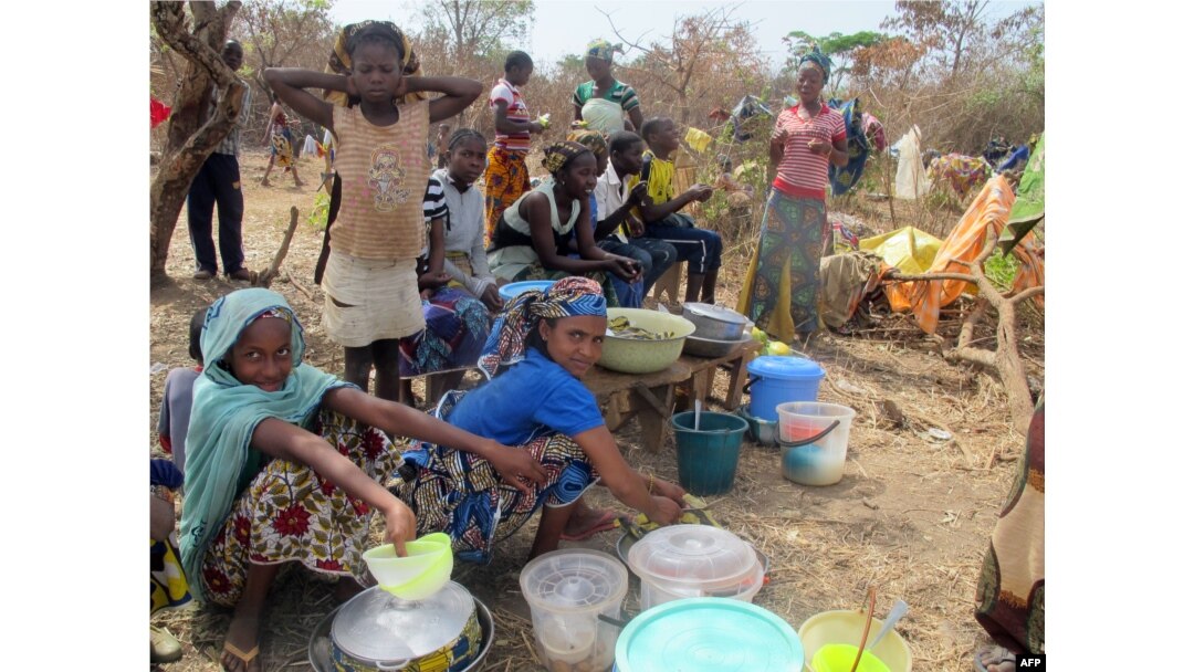 FILE - Refugees from Central Africa sit in the eastern Cameroonian village of Gado Badzere, near the city of Garoua-Boulai, not far from the border with Central Africa.