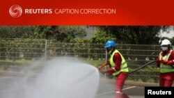 Sierra Leone is just the latest African country to be hit by the coronavirus. Here, Nigerian fire service crews in Abuja decontaminate a street on April 2, 2020, as part of Nigeria's anti-virus efforts.