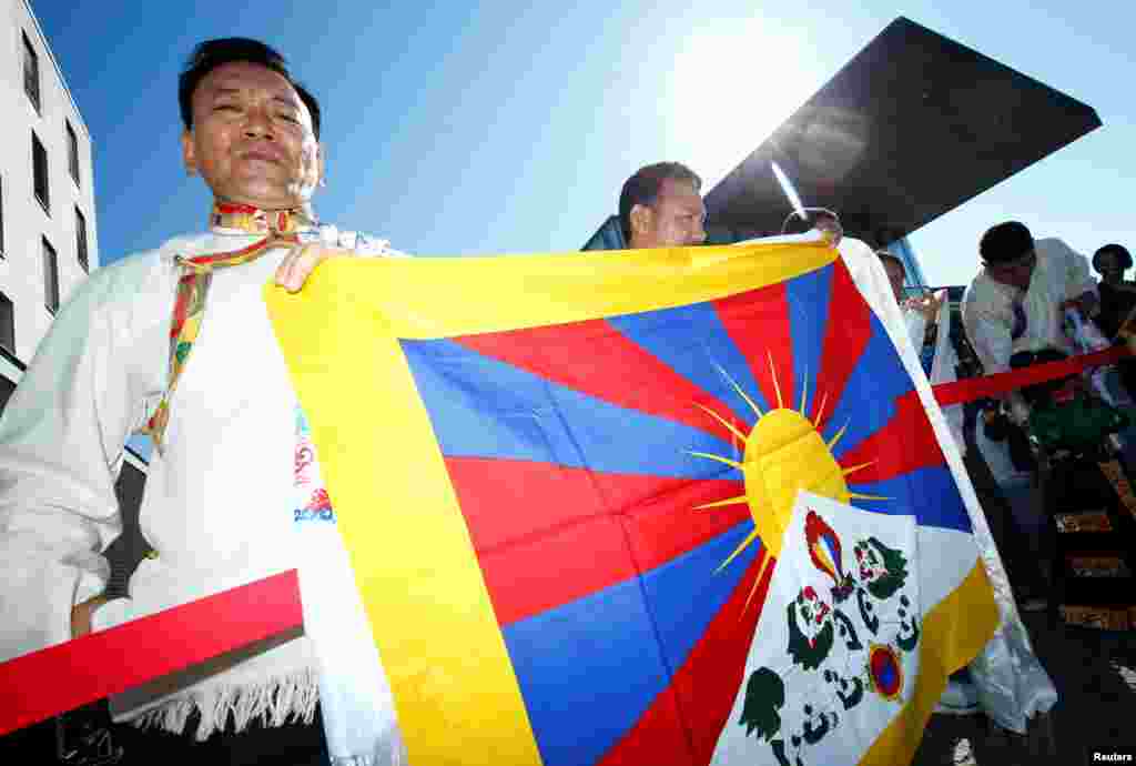 People await the arrival of Tibetan spiritual leader the Dalai Lama in Darmstadt, Germany.