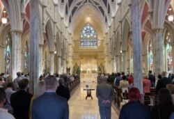 Perayaan Paskah di Katedral Santo Yohanes Pembaptis di Charleston, South Carolina, 4 April 2021 di tengah pandemi COVID-19. (Foto: Daniel SLIM / AFP)