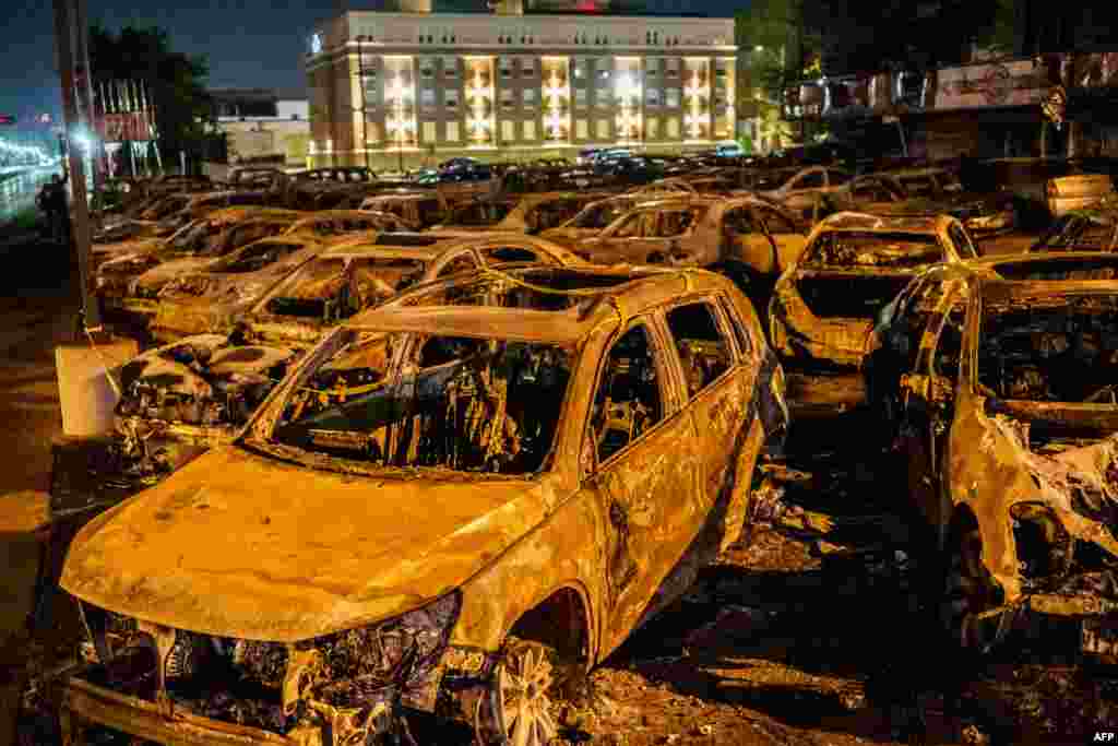 The remains of cars burned by protesters the night before during a demonstration against the shooting of Jacob Blake are seen at a used-cars lot in Kenosha, Wisconsin, Aug. 26, 2020.