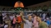 After the end of the rituals, Muslims pose for a selfie in Amr Ibn al-As mosque, in old Cairo, Egypt, May 31, 2019. 