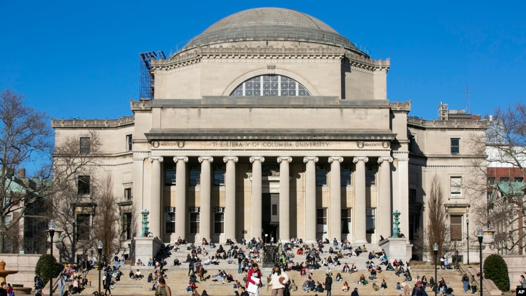 FILE - Students relax on the front steps of Low Memorial Library on the Columbia University campus in New York City on Feb. 10, 2023. 