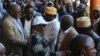 FILE - Incumbent Comoros President Azali Assoumani (front) greets supporters in Moroni on March 27, 2019 during celebrations for his re-election.