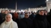 People attend as Cardinal Robert Francis Prevost, Prefect of the Dicastery for Bishops, leads the recitation of the Holy Rosary for Pope Francis' health in St Peter's Square at the Vatican, March 3, 2025. 