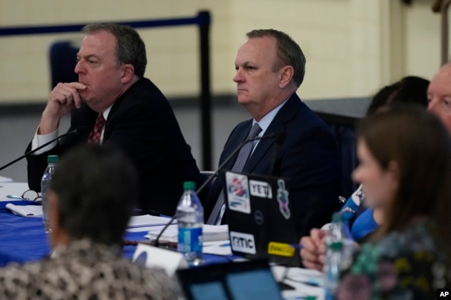 New College of Florida's interim President Richard Corcoran, center, listens during a meeting of the college's board of trustees, alongside trustee Matthew Spalding, left, Tuesday, Feb. 28. (AP Photo/Rebecca Blackwell, File)