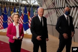 European Commission President Ursula von der Leyen, left, U.S. President Joe Biden, center and European Council President Charles Michel arrive for the EU-US summit at the European Council building in Brussels, June 15, 2021.