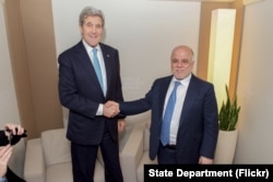 U.S. Secretary of State John Kerry shakes hands with Iraqi Prime Minister Haider al-Abadi before a bilateral meeting amid the World Economic Forum in Davos, Switzerland, Jan. 21, 2016.