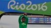 Silver medal Ethiopia's Feyisa Lilesa crosses his arms as he celebrates on the podium after the men's marathon at the 2016 Summer Olympics in Rio de Janeiro, Brazil, Aug. 21, 2016. 