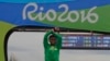Silver medalist Ethiopia's Feyisa Lilesa, crosses his arms as he celebrates on the podium after the men's marathon at the 2016 Summer Olympics in Rio de Janeiro, Brazil, Sunday, Aug. 21, 2016. 