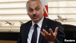 Turkish Airlines Chief Executive Officer Temel Kotil gestures during an interview with Reuters in Istanbul, April 17, 2013. 
