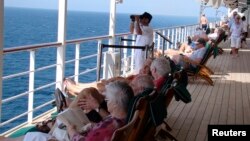 A watchkeeper is seen on the deck of the Queen Mary 2 in the southern Red Sea, January 24, 2013.