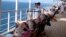 A watchkeeper is seen on the deck of the Queen Mary 2 in the southern Red Sea, January 24, 2013.