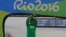 FILE - Silver medalist Ethiopia's Feyisa Lilesa, crosses his arms as he celebrates on the podium after the men's marathon at the 2016 Summer Olympics in Rio de Janeiro, Brazil, Aug. 21, 2016. 