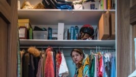 This photo shows a self-portrait by artist Lara Alcantara in her home in the Brooklyn borough of New York. The Venezuelan photographer has channeled her pandemic-related anxiety through a series of self-portraits that sometimes put her in an imaginary world. (Lara Alcantara via AP)