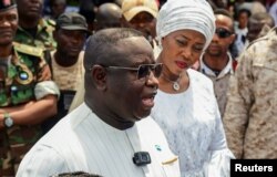 FILE - Sierra Leone's President and ruling party candidate Julius Maada Bio speaks to journalists at a polling station in Freetown, Sierra Leone, June 24, 2023.