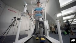 Toyota's robotic leg brace is designed to help partially paralyzed people walk. 