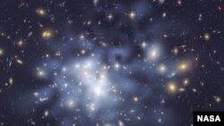 NASA Hubble Space Telescope image shows the distribution of dark matter in the center of the giant galaxy cluster Abell 1689, containing about 1,000 galaxies and trillions of stars. (File Photo)