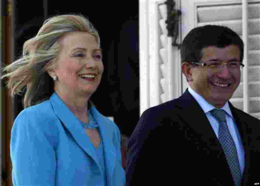 U. S. Secretary of State Hillary Rodham Clinton and her Turkish counterpart Ahmet Davutoglu arrive to address the media after their talks in Istanbul, Turkey, Saturday, July 16, 2011. (AP Photo/Burhan Ozbilici)