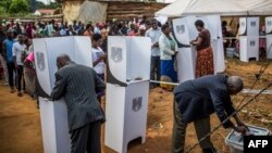 People cast their votes at a polling station in Mzuzu, Malawi during general elections on May 21, 2019.